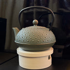 Dessous de théière chauffant à bougie