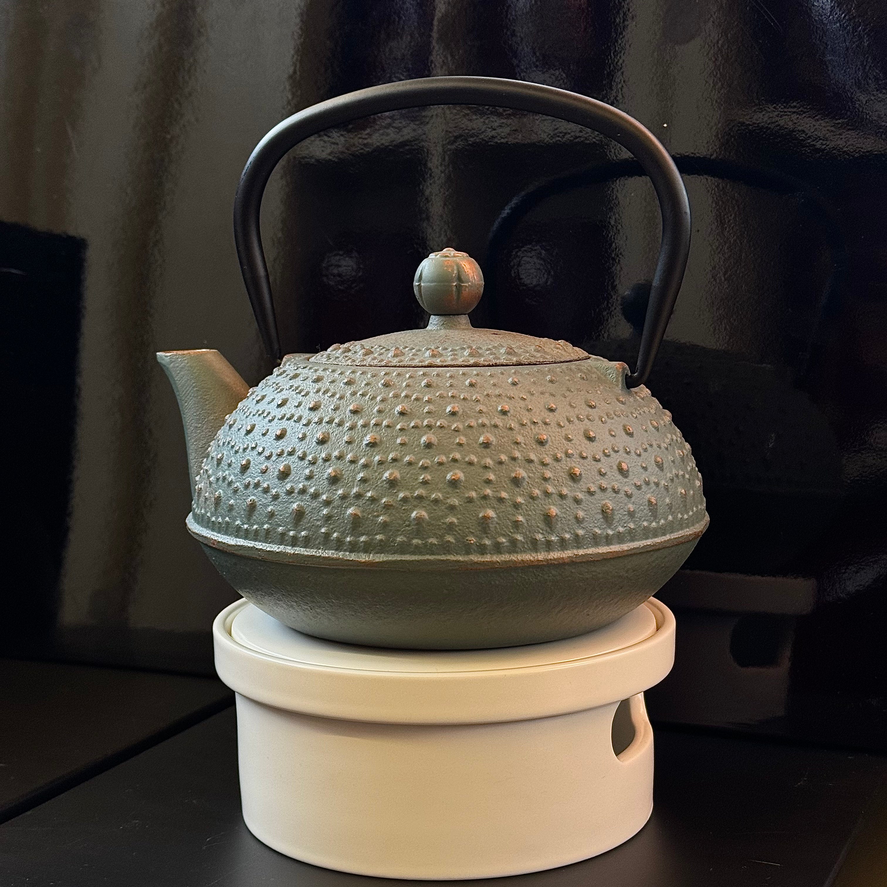 Dessous de théière chauffant à bougie